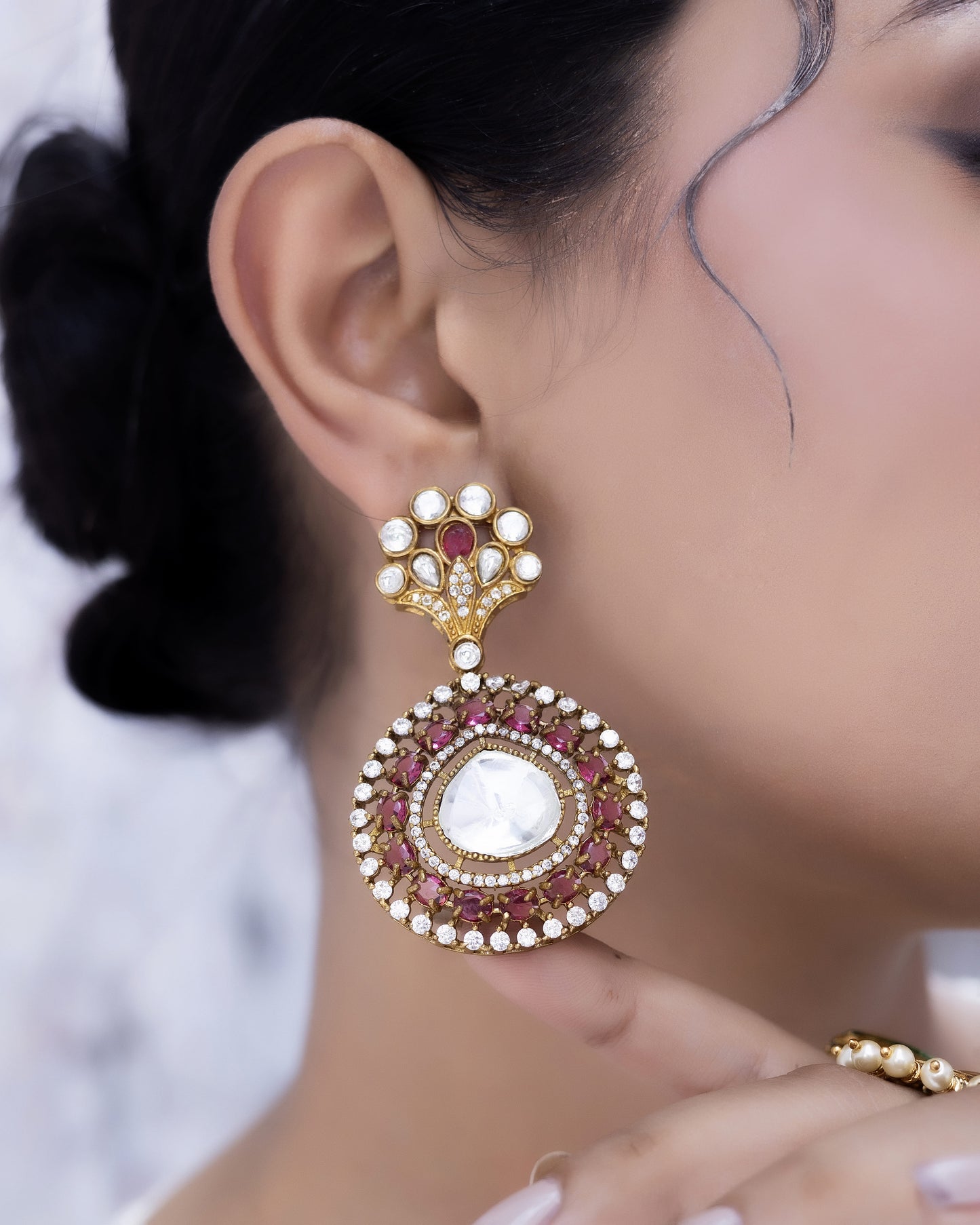 Kumudini – Ruby circular polki studs with festive glow.