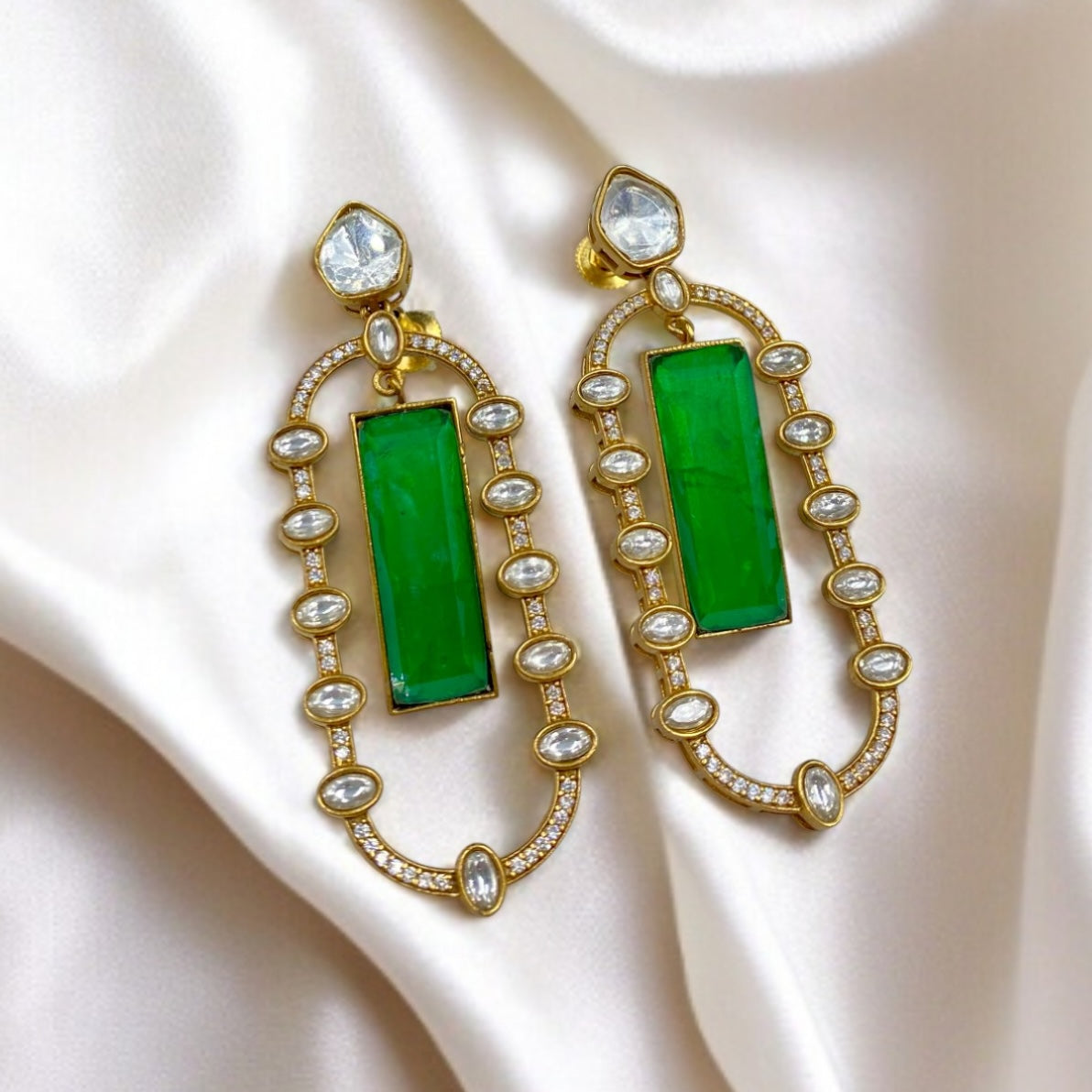 Meher – Diamond and emerald stone earrings.