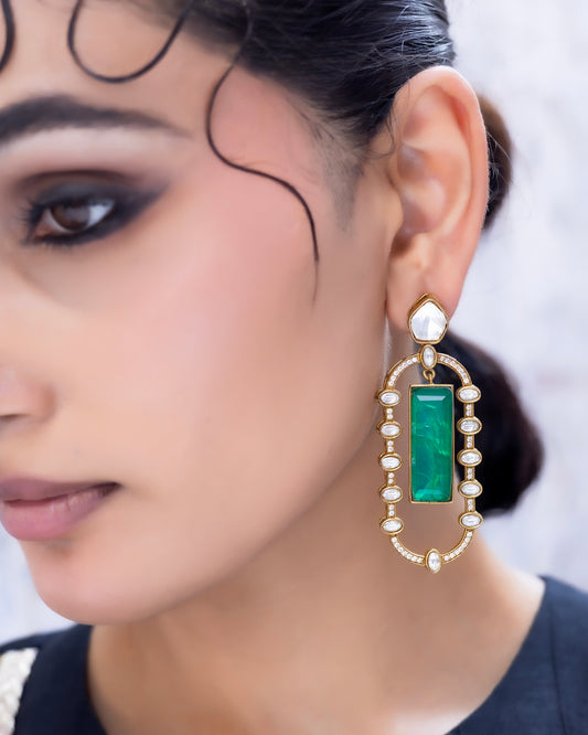 Meher – Diamond and emerald stone earrings.